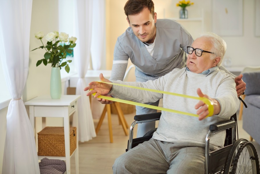 Therapist helping patient with rehabilitation exercises